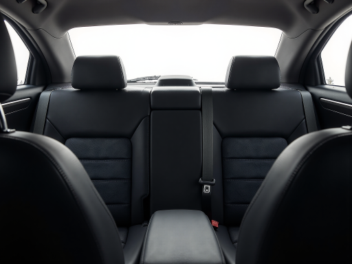 Used sedan, black color, front view, well-maintained condition, indoor lighting